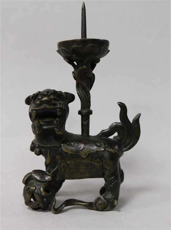 A Chinese bronze lion pricket candlestick, late Ming dynasty